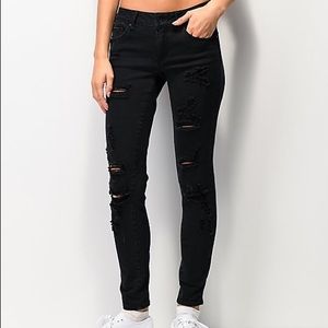 Black distressed ripped skinny jeans